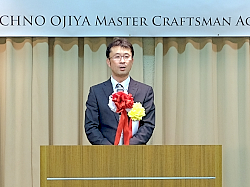 190507テクノ小千谷2 あいさつする山﨑理事長